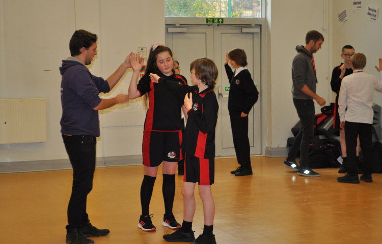 Image of Students receive a stage combat class from local youth theatre 